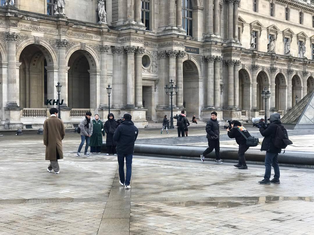 The photo was taken front of the Louvre Museum in Paris